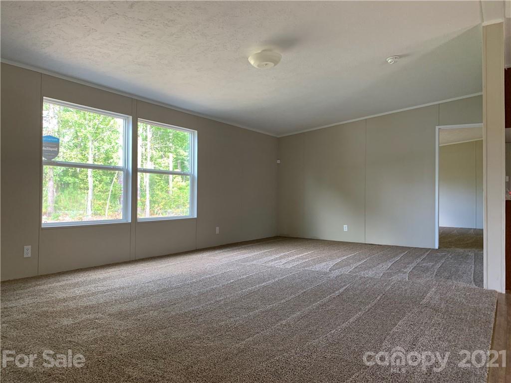 169 Mosley Road Blacksburg, SC 29702 - Photo 5 of 20 an empty room with windows