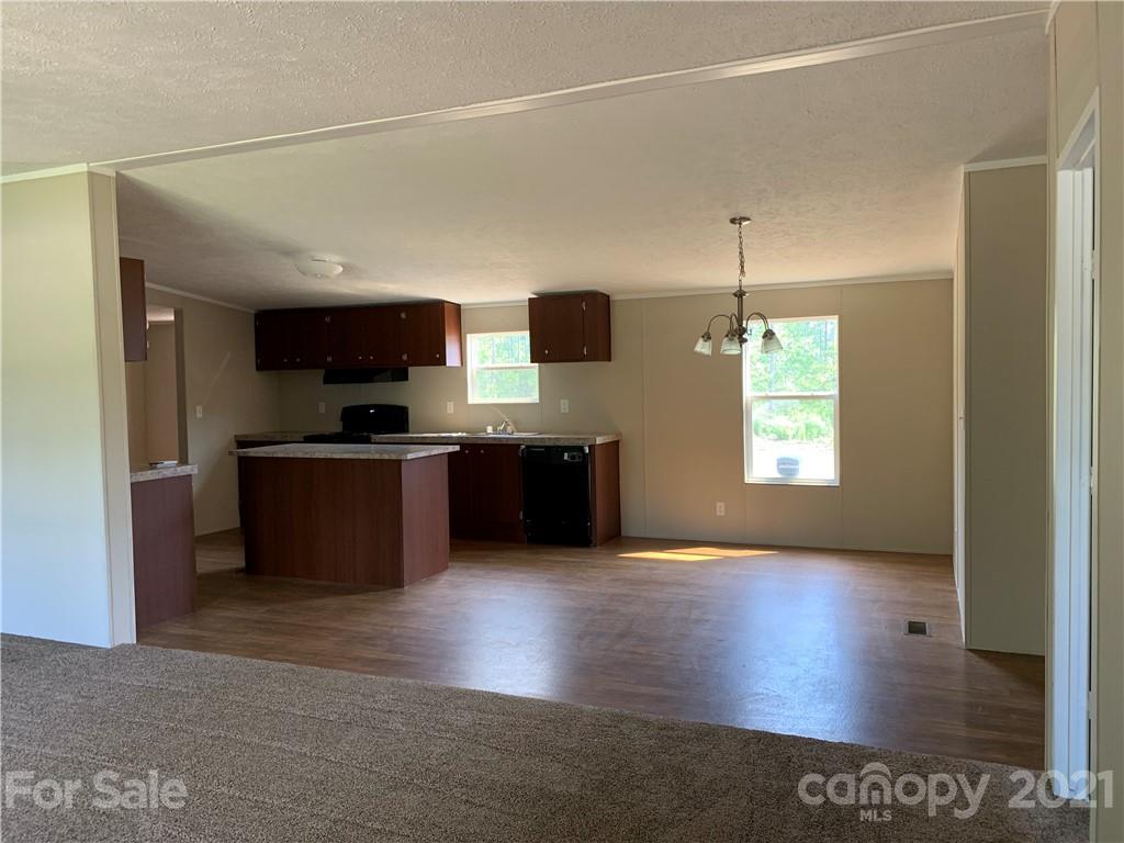 169 Mosley Road Blacksburg, SC 29702 - Photo 6 of 20 a kitchen with stainless steel appliances granite countertop a stove a sink and a refrigerator