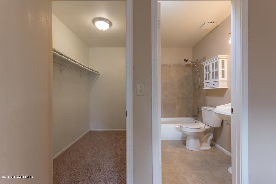 8049 East Barbara Road Prescott Valley, AZ 86314 - Photo 19 of 23 a bathroom with a toilet sink and a shower