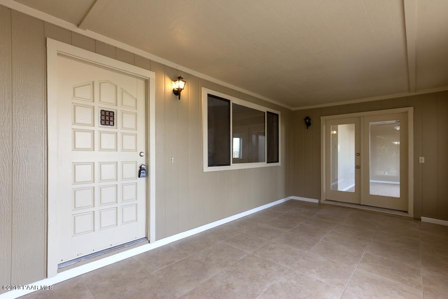 8049 East Barbara Road Prescott Valley, AZ 86314 - Photo 4 of 23 a view of an empty room with window