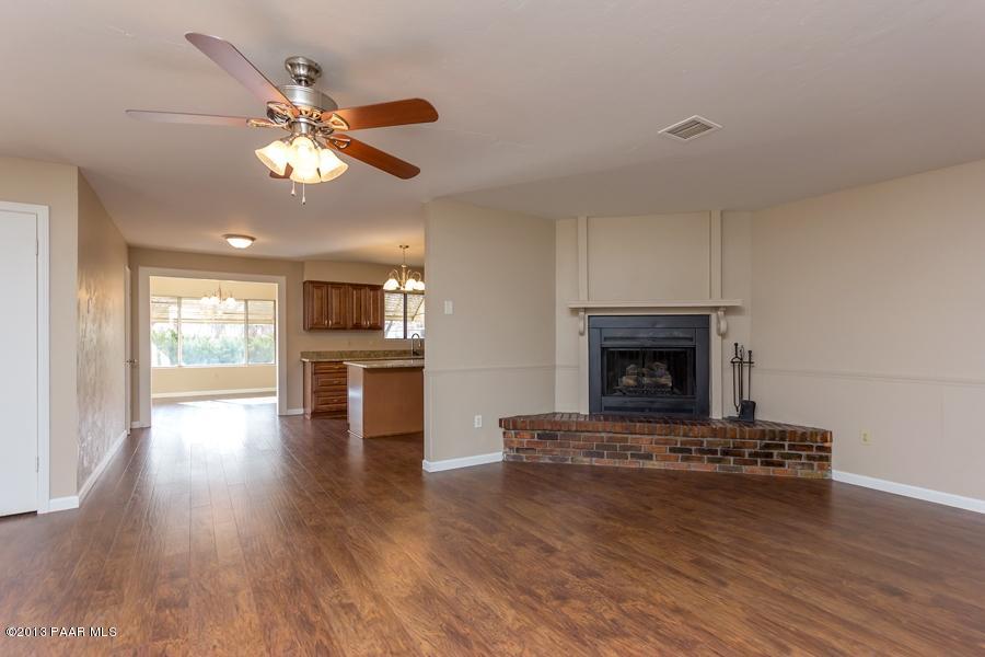 8049 East Barbara Road Prescott Valley, AZ 86314 - Photo 6 of 23 a living room with furniture and a fireplace