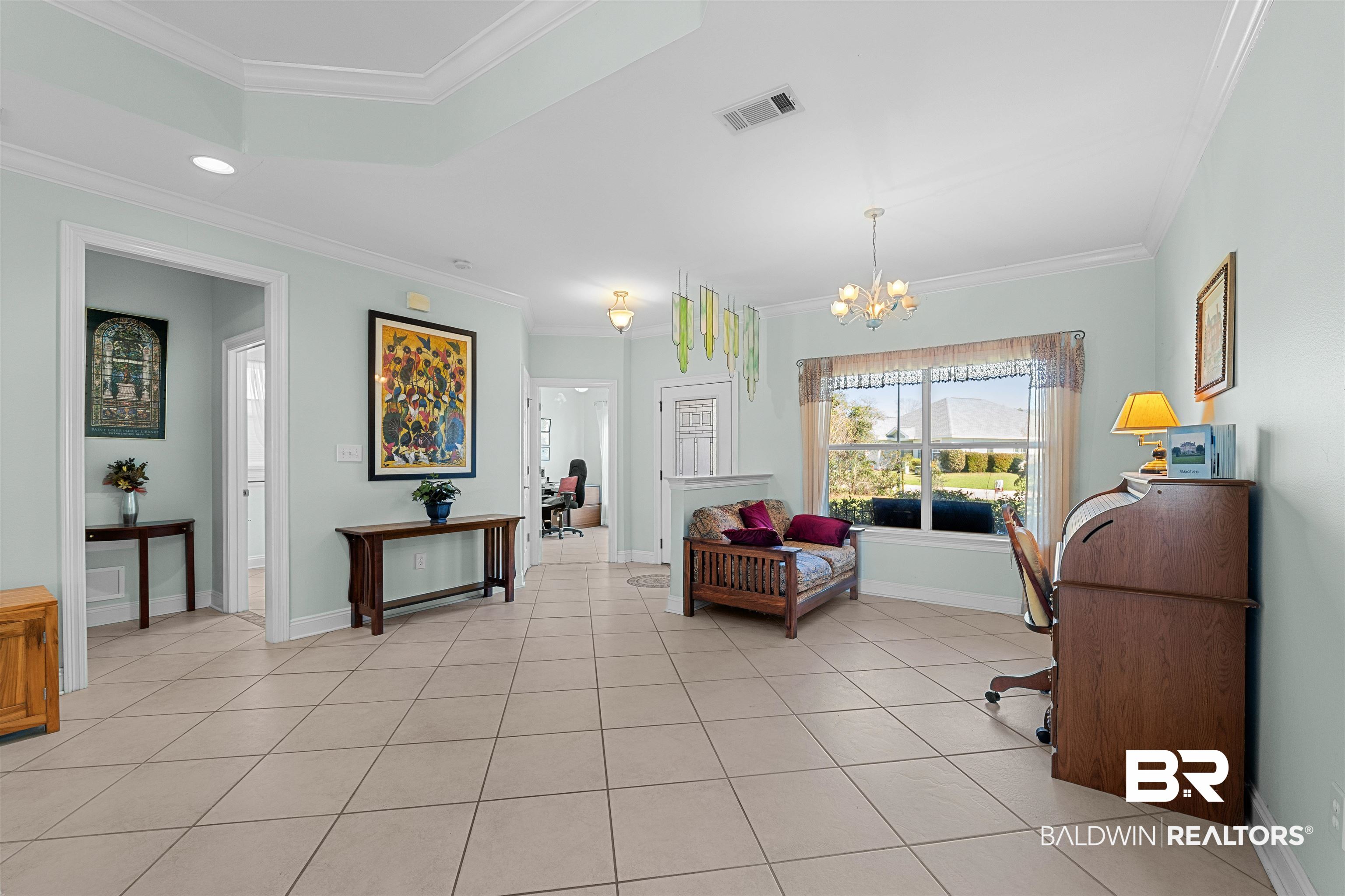 237 Hemingway Loop Foley, AL 36535 - Photo 7 of 49 Sitting room with light tile patterned floors, visible vents, and crown molding
