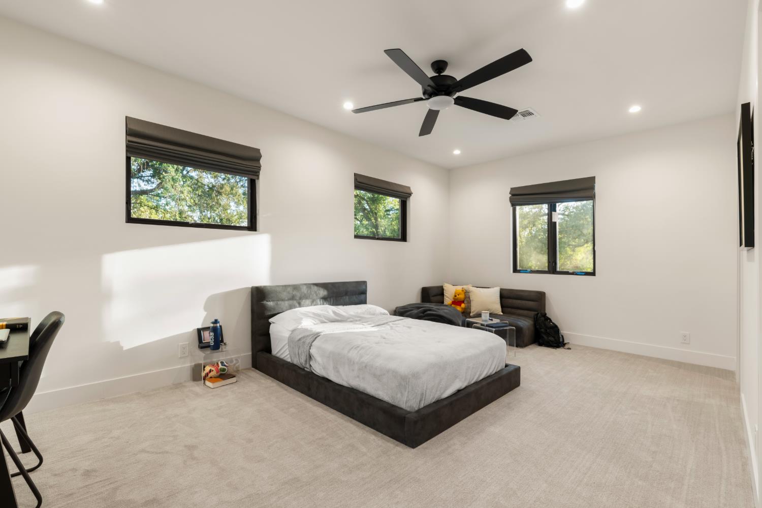 7697 Horseshoe Bar Road Loomis, CA 95650 - Photo 44 of 76 a bedroom with a bed a window and a painting on the wall