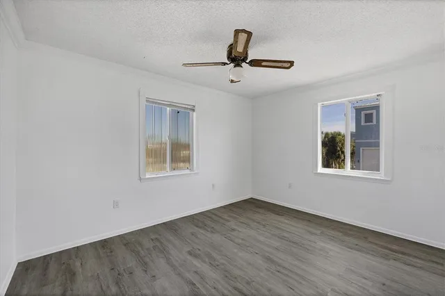 a view of an empty room with windows