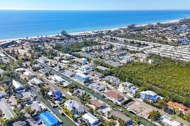 an aerial view of a city with ocean view