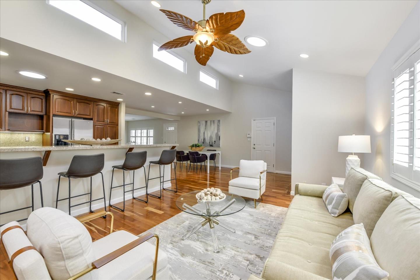 828 Linda Mar Boulevard Pacifica, CA 94044 - Photo 13 of 44 a living room with furniture kitchen view and a chandelier