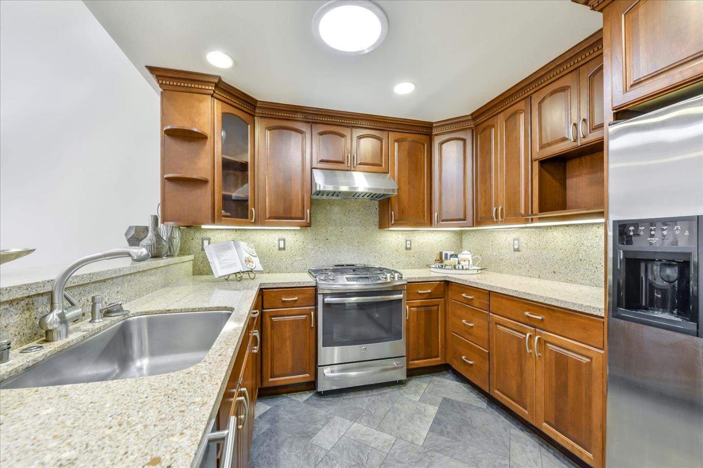 828 Linda Mar Boulevard Pacifica, CA 94044 - Photo 15 of 44 a kitchen with stainless steel appliances granite countertop a sink stove and cabinets