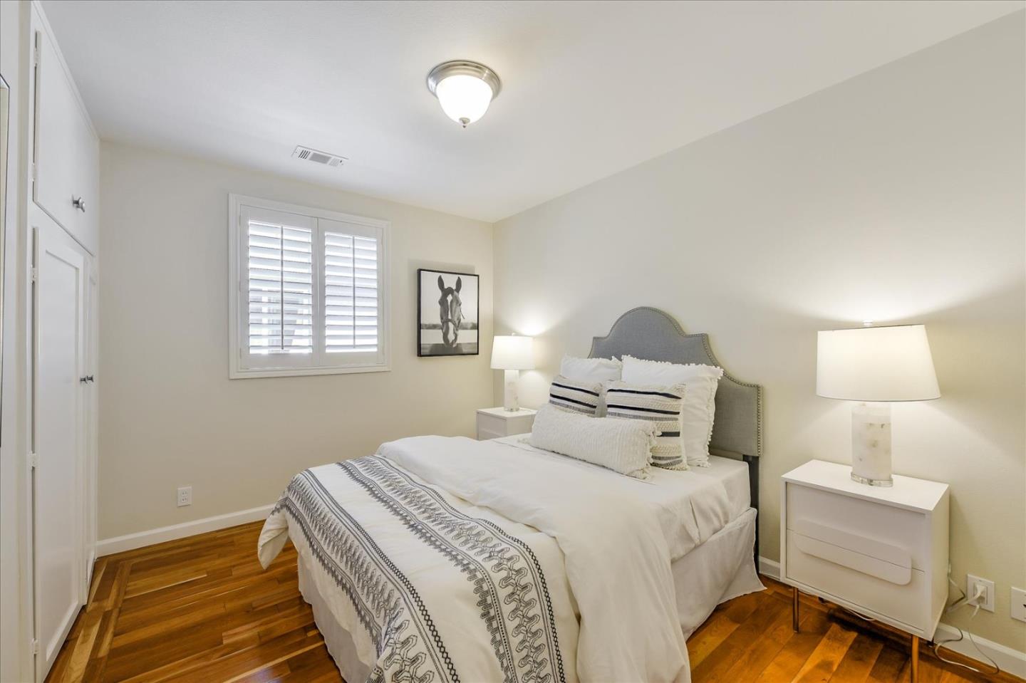 828 Linda Mar Boulevard Pacifica, CA 94044 - Photo 23 of 44 a bedroom with a bed and a window