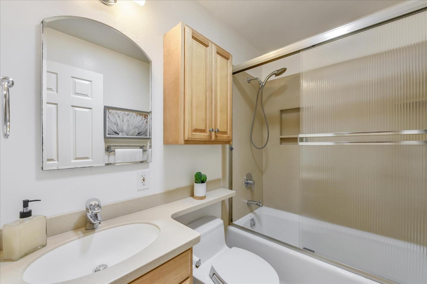 828 Linda Mar Boulevard Pacifica, CA 94044 - Photo 28 of 44 a bathroom with a sink toilet and shower