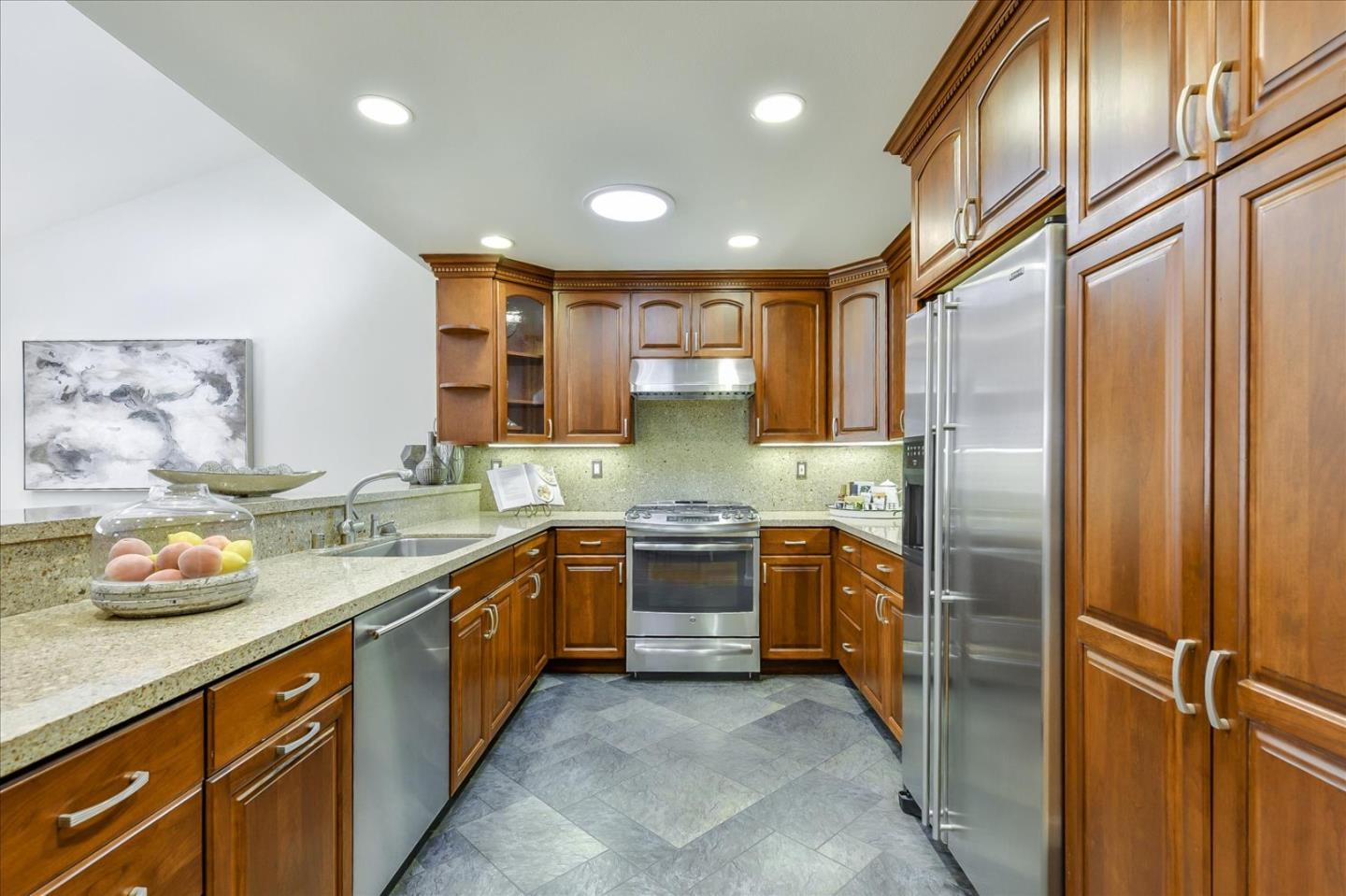 828 Linda Mar Boulevard Pacifica, CA 94044 - Photo 3 of 44 a large kitchen with stainless steel appliances granite countertop a refrigerator and a sink