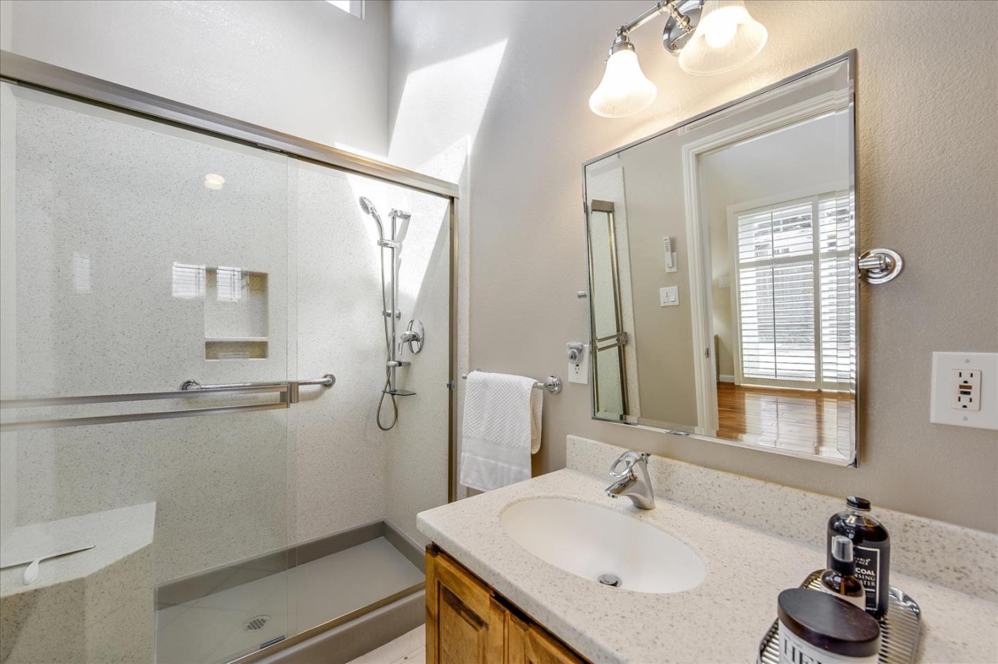 828 Linda Mar Boulevard Pacifica, CA 94044 - Photo 33 of 44 a bathroom with a sink and a mirror