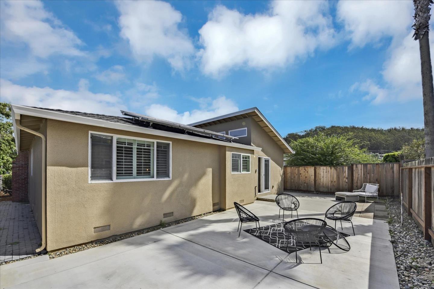828 Linda Mar Boulevard Pacifica, CA 94044 - Photo 36 of 44 a backyard of a house with outdoor seating