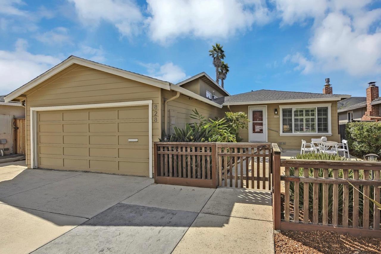 828 Linda Mar Boulevard Pacifica, CA 94044 - Photo 5 of 44 a front view of a house with a garage