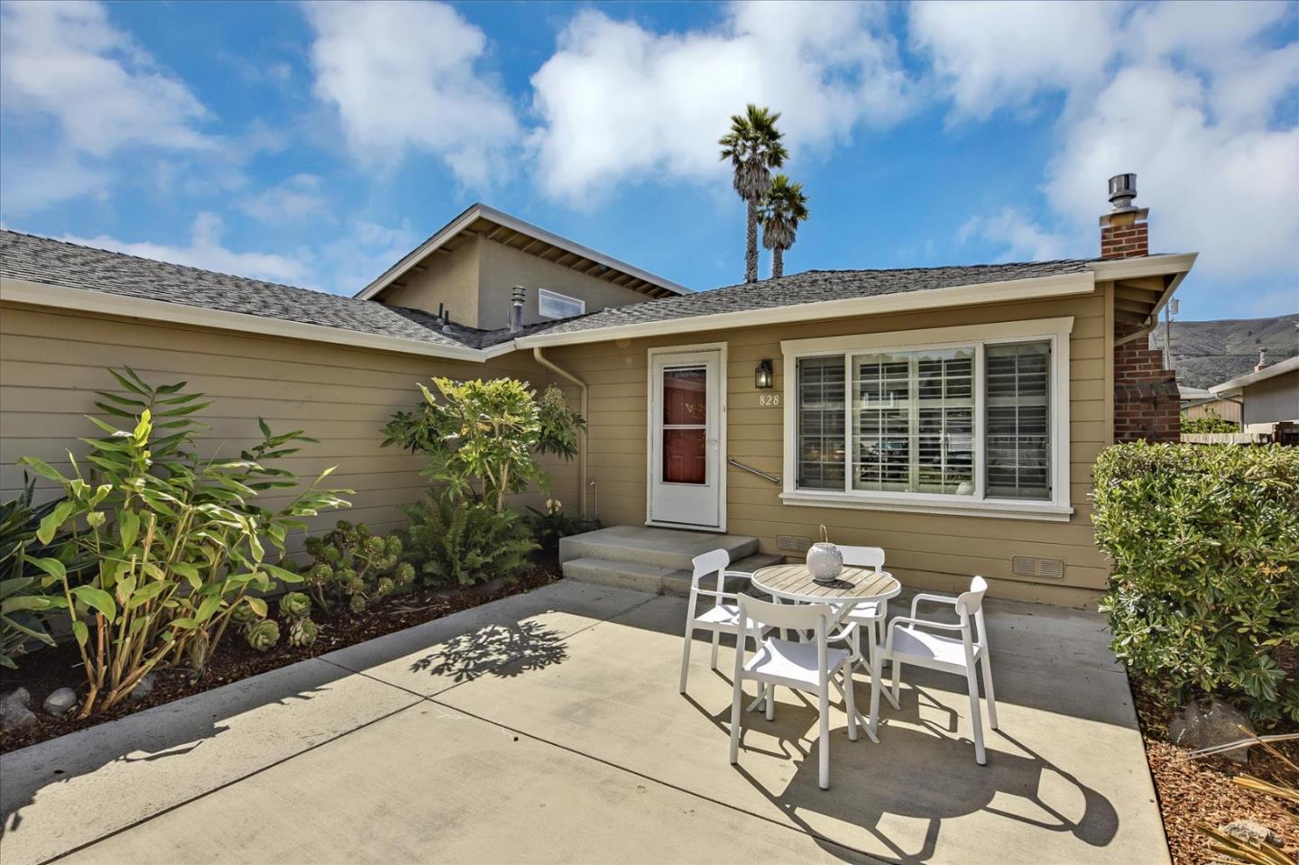 828 Linda Mar Boulevard Pacifica, CA 94044 - Photo 7 of 44 a view of a patio with table and chairs and potted plants