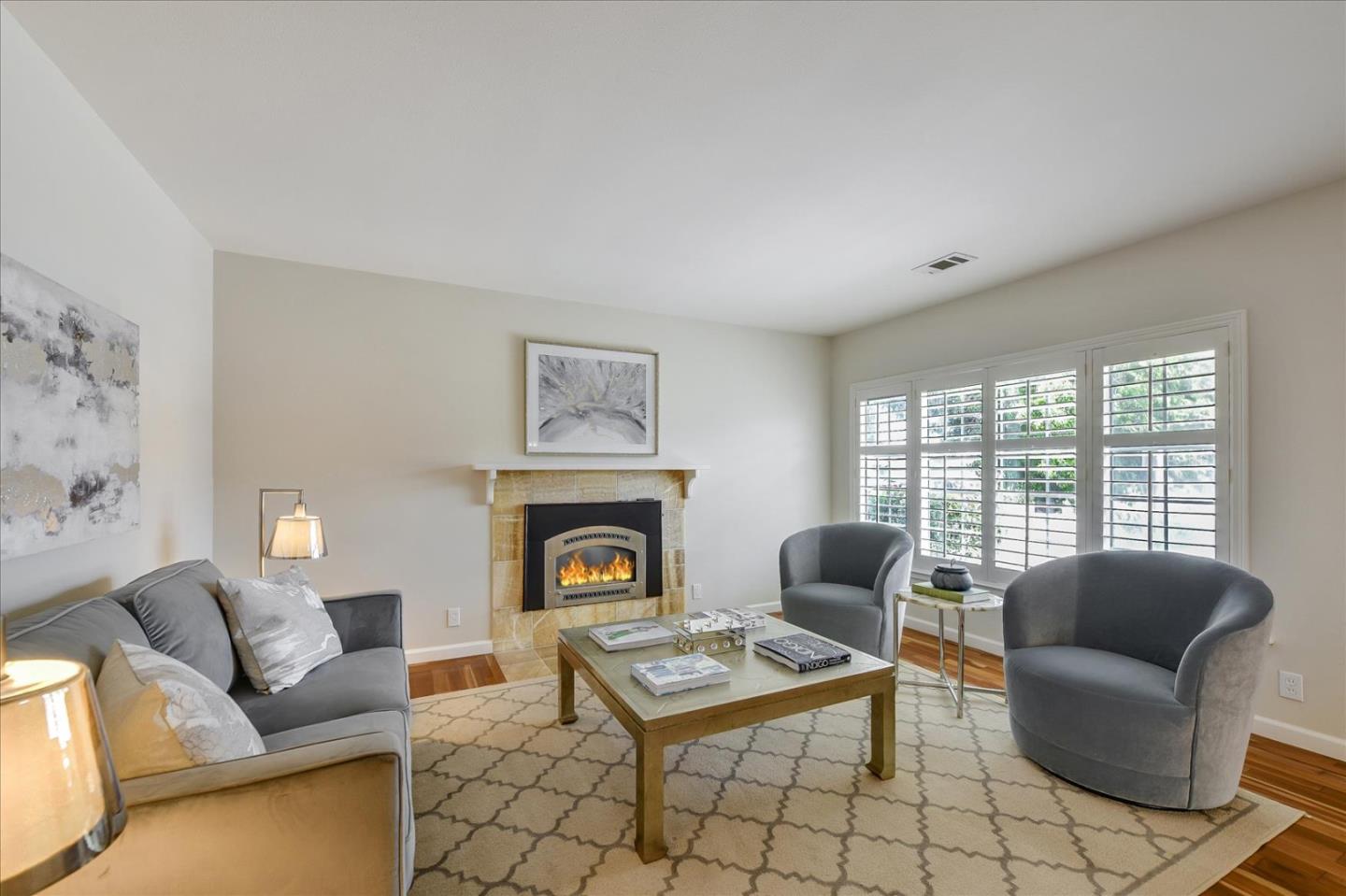 828 Linda Mar Boulevard Pacifica, CA 94044 - Photo 8 of 44 a living room with furniture a rug a fireplace and a window