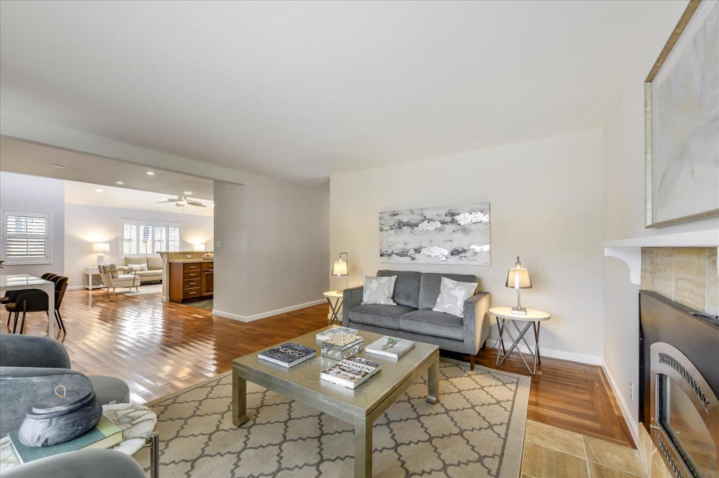 828 Linda Mar Boulevard Pacifica, CA 94044 - Photo 10 of 44 a living room with furniture and a fireplace