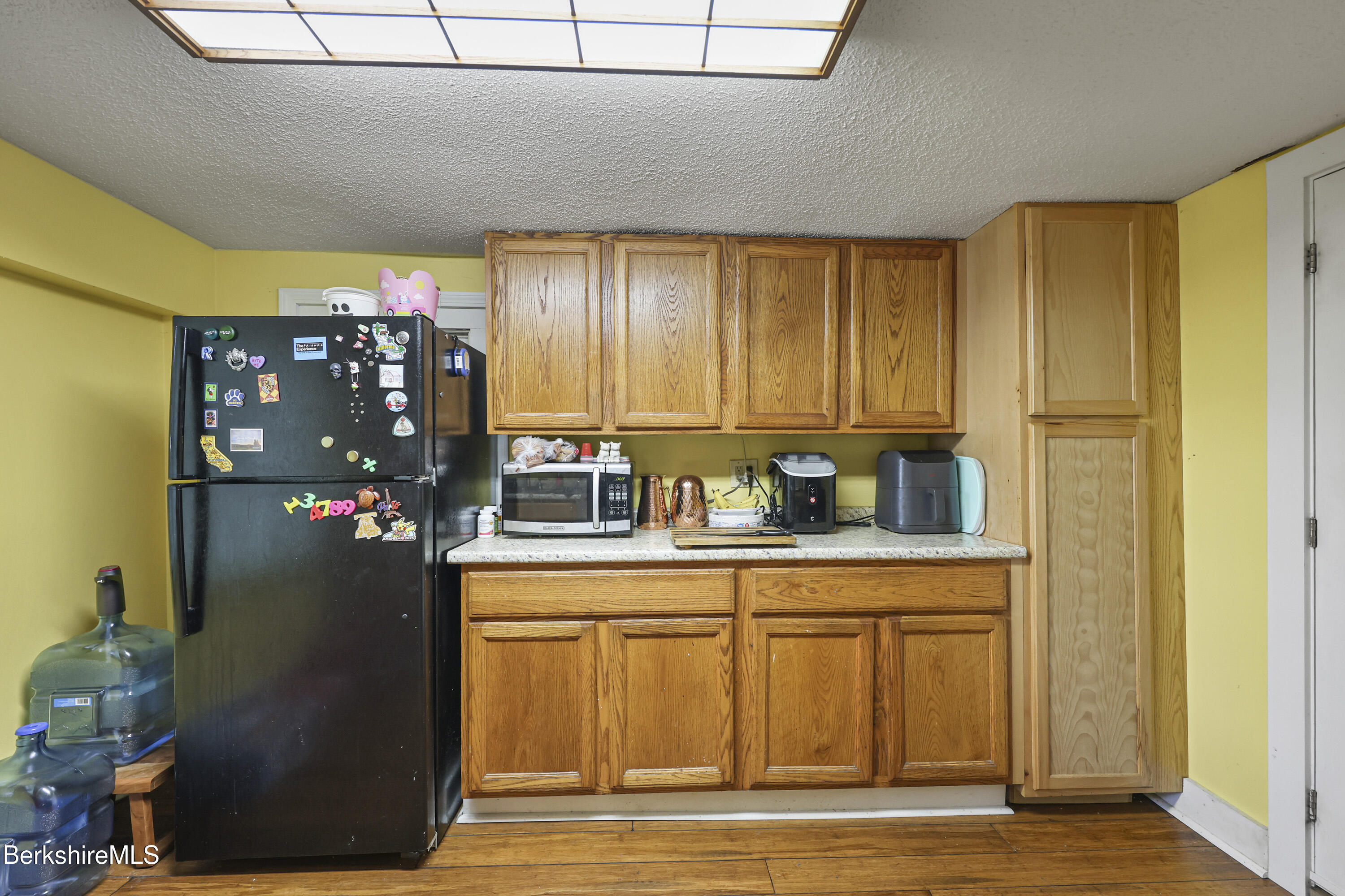 1 Maple Street Hinsdale, MA 01235 - Photo 12 of 17 a kitchen with stainless steel appliances granite countertop a refrigerator and a sink
