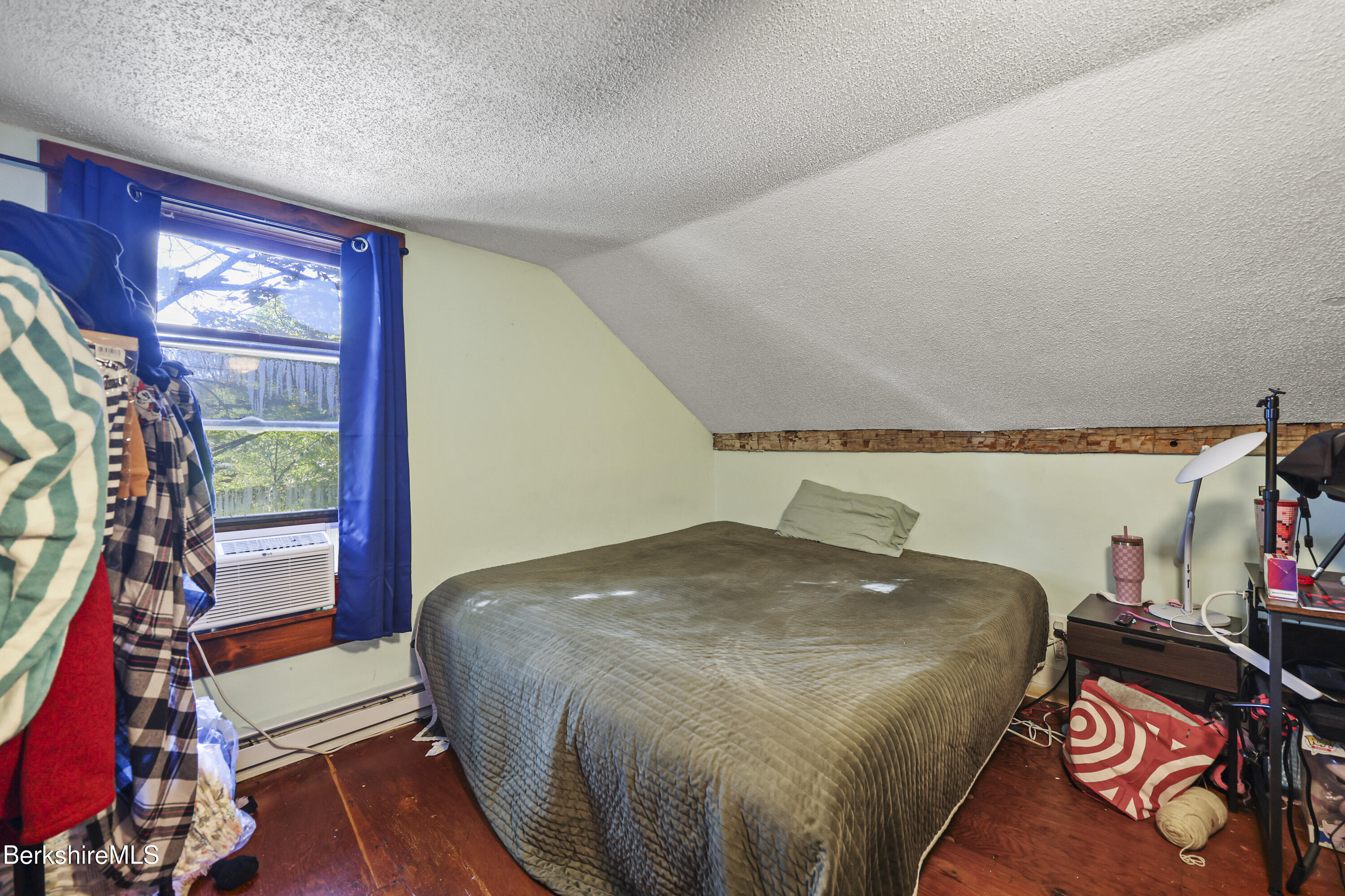 1 Maple Street Hinsdale, MA 01235 - Photo 16 of 17 a bed sitting in a bedroom next to a window