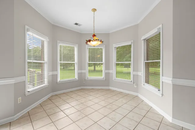 a view of a room with windows