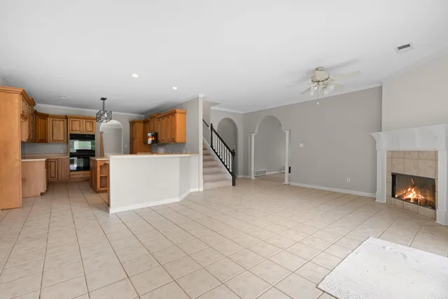 an aerial view of residential house with outdoor space and trees all around