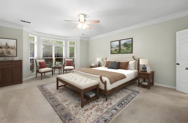 an empty room with windows and fireplace