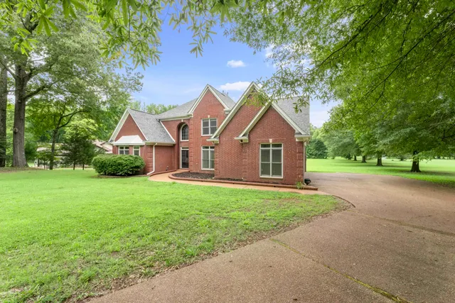 a front view of a house with yard