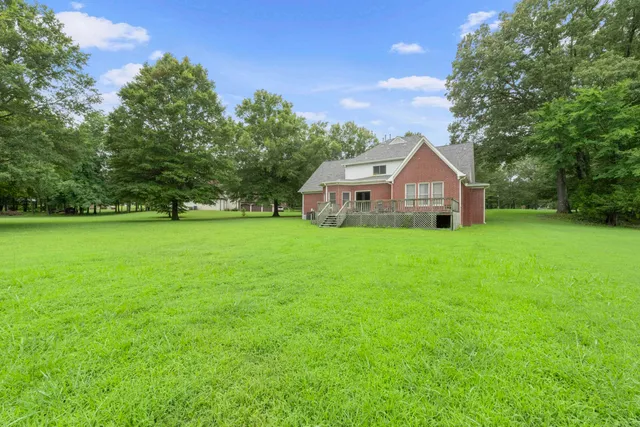 a view of balcony with wooden floor and outdoor seating