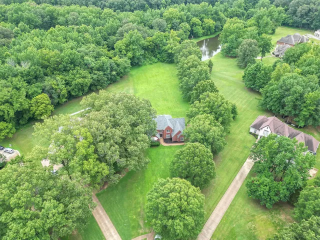 a view of a house with a yard porch and sitting area