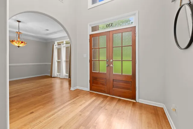 a view of a room with wooden floor and cabinet