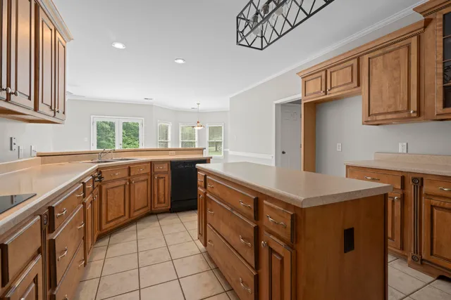 a kitchen with a sink stove and cabinets