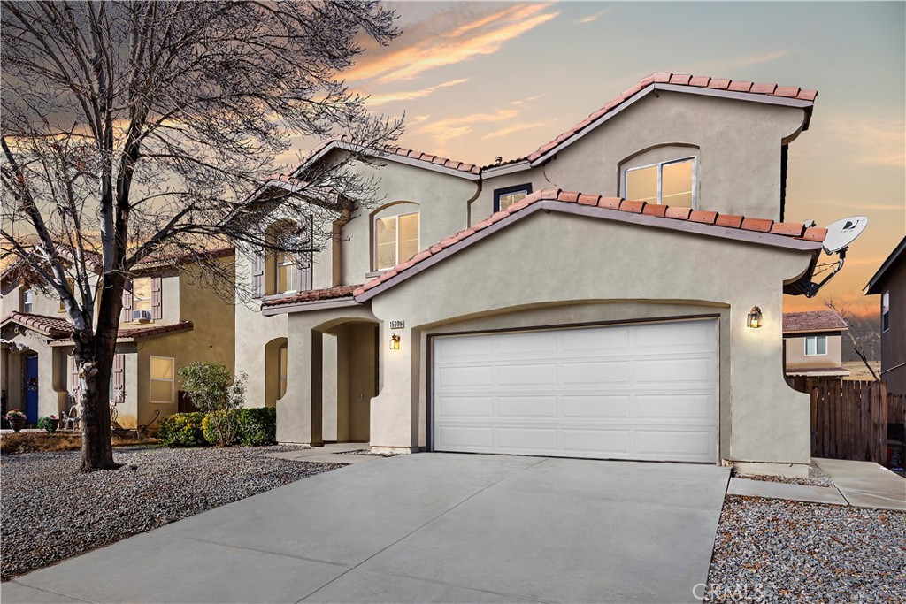 15098 Sorrel Road Victorville, CA 92394 - Photo 1 of 1 a front view of a house with a garage