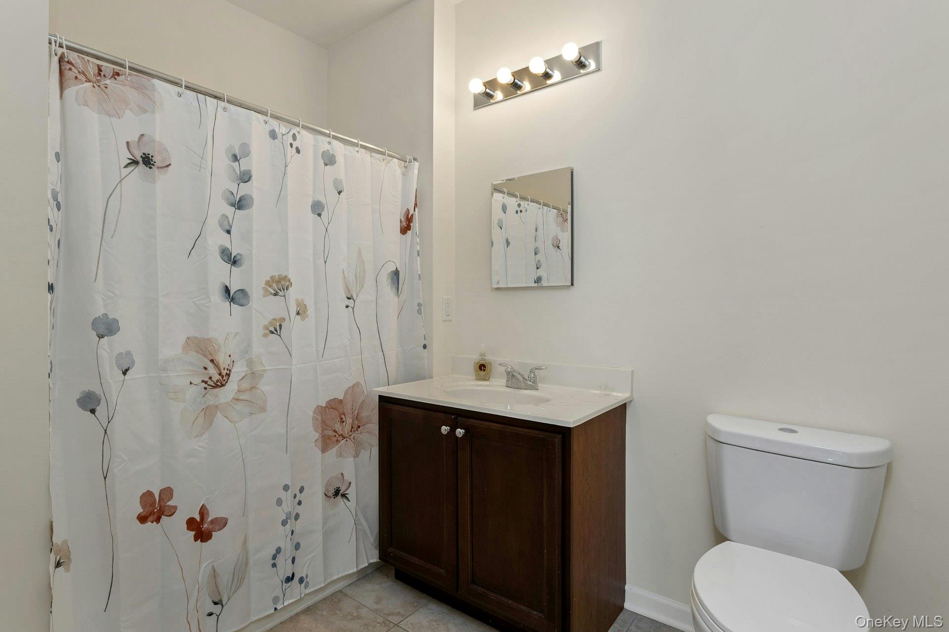 2004 Bennington Drive Fishkill, NY 12524 - Photo 19 of 25 a bathroom with a toilet a sink and a shower