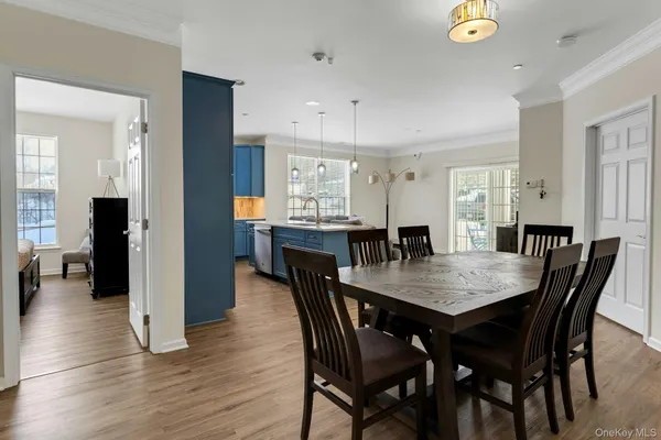 a large kitchen with a table and chairs