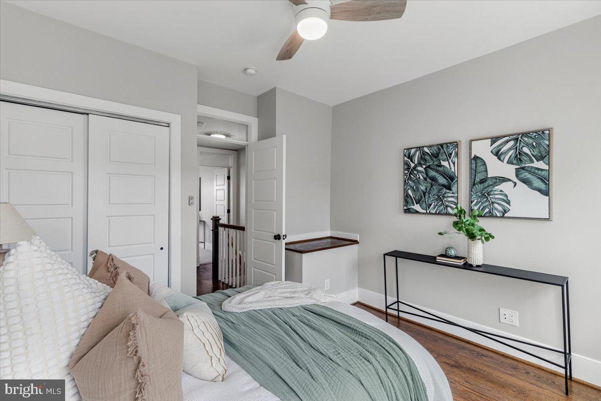 635 20th Street Northeast Washington, DC 20002 - Photo 18 of 33 a bedroom with a bed and a chandelier
