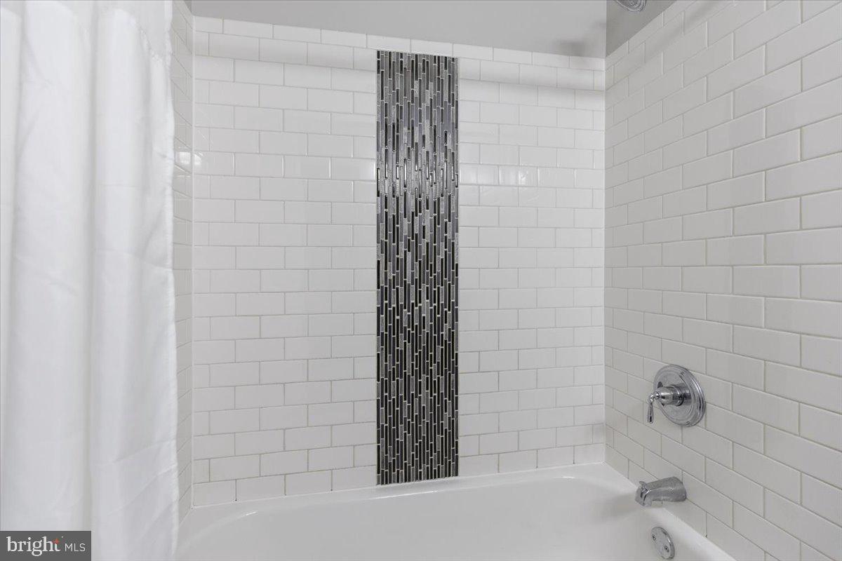 635 20th Street Northeast Washington, DC 20002 - Photo 24 of 33 a bathroom with a bathtub and shower