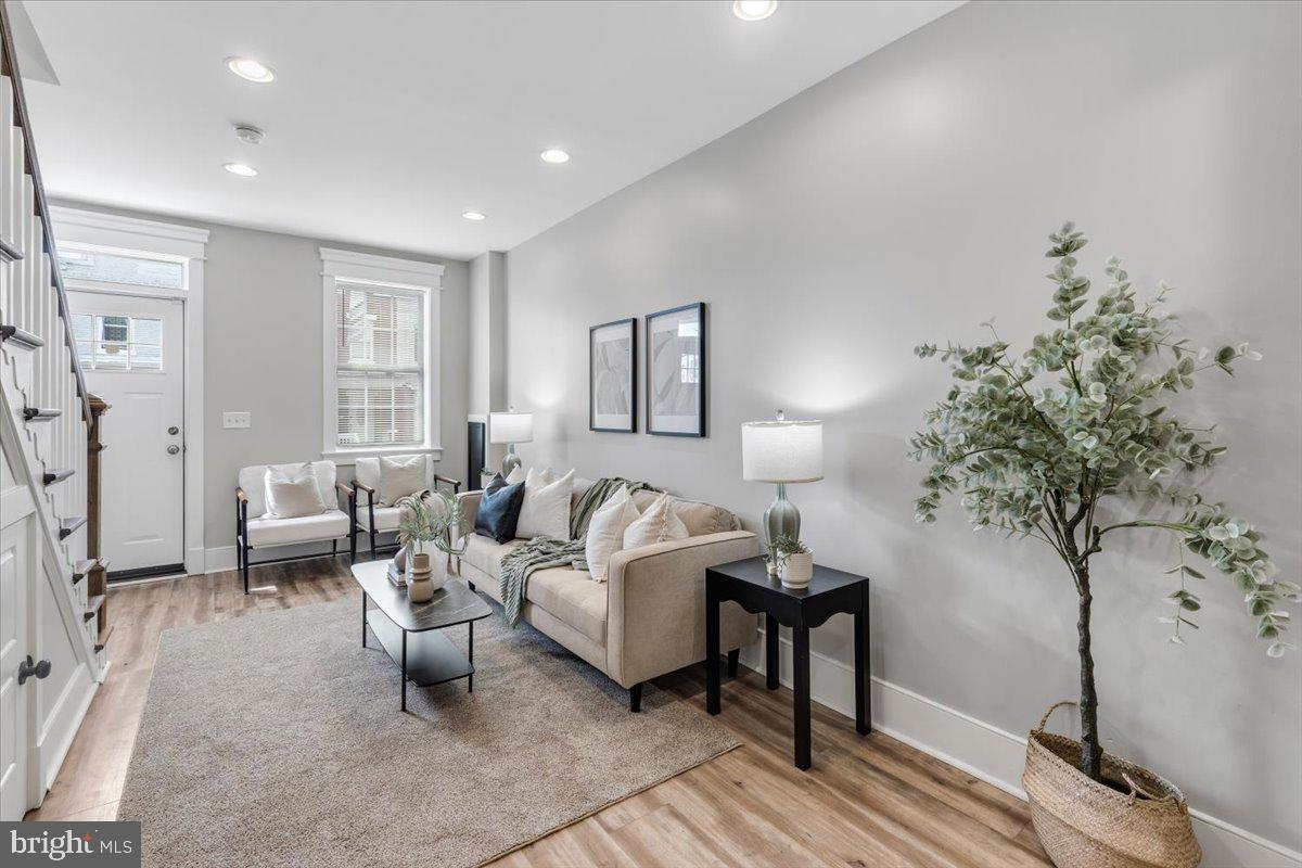 635 20th Street Northeast Washington, DC 20002 - Photo 5 of 33 a living room with furniture and a potted plant