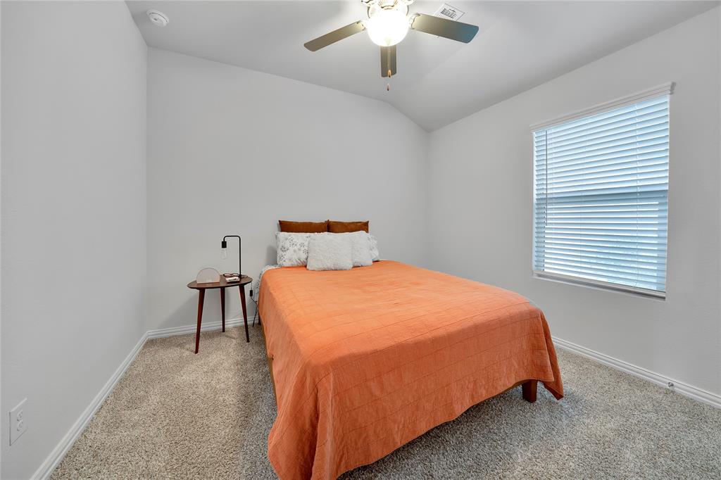 1817 Berry Rdg Trail Aubrey, TX 76227 - Photo 19 of 30 a bedroom with a bed and window
