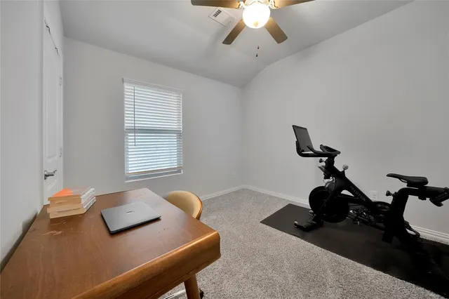 a bedroom with furniture and a window
