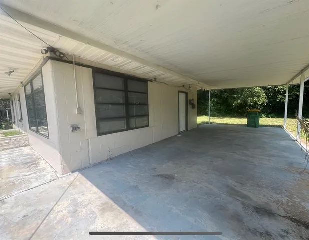 a view of an empty room with a balcony