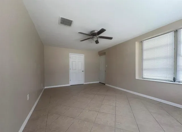 a view of an empty room with a window
