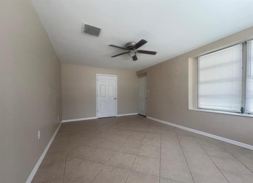 15 Haselton Street Eustis, FL 32726 - Photo 6 of 10 a view of an empty room with a window