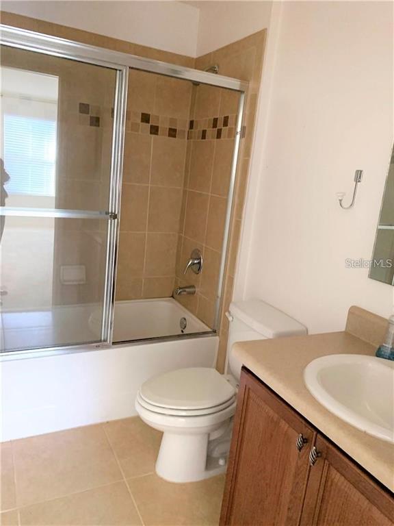 3826 Exeter Lane Lakeland, FL 33809 - Photo 8 of 10 a white toilet sitting next to a bath tub
