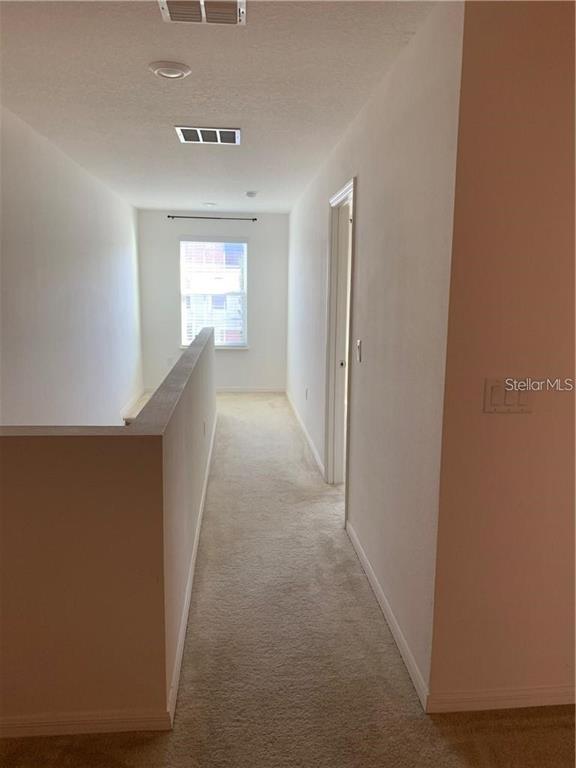 3826 Exeter Lane Lakeland, FL 33809 - Photo 10 of 10 a view of a hallway with windows