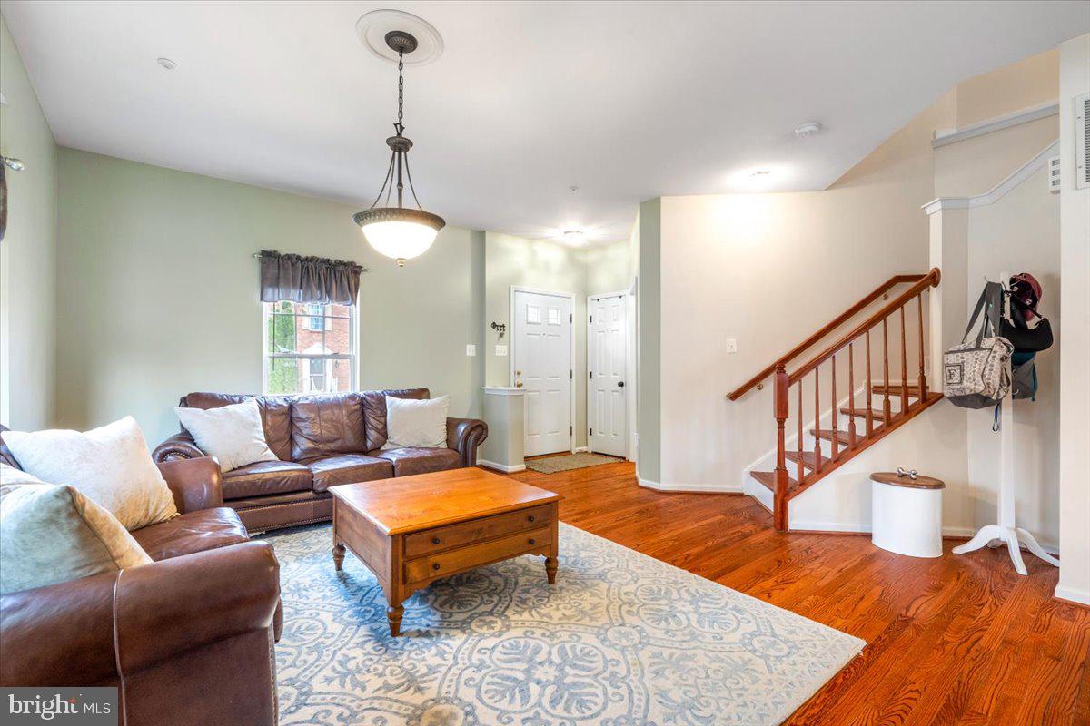 1729 Emory Street Frederick, MD 21701 - Photo 11 of 50 a living room with furniture ceiling fan and a rug