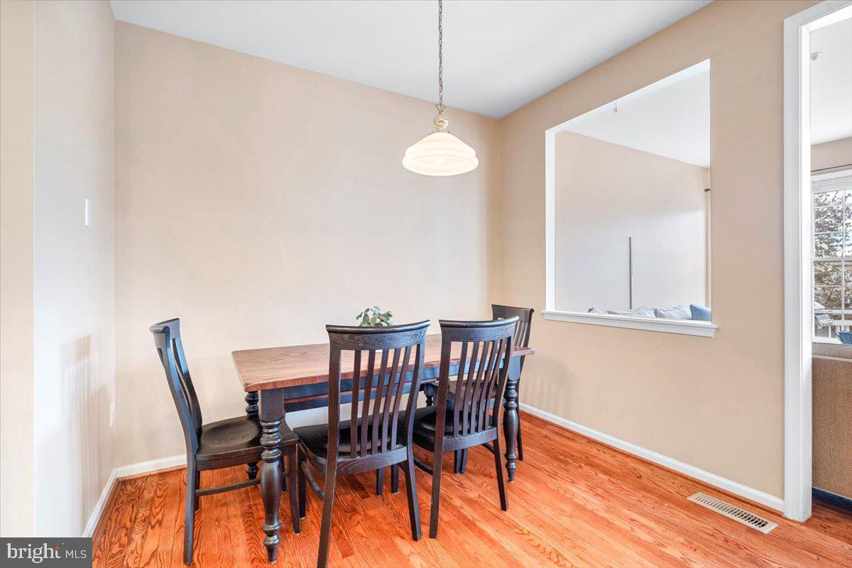 1729 Emory Street Frederick, MD 21701 - Photo 14 of 50 a view of a dining room with furniture and wooden floor