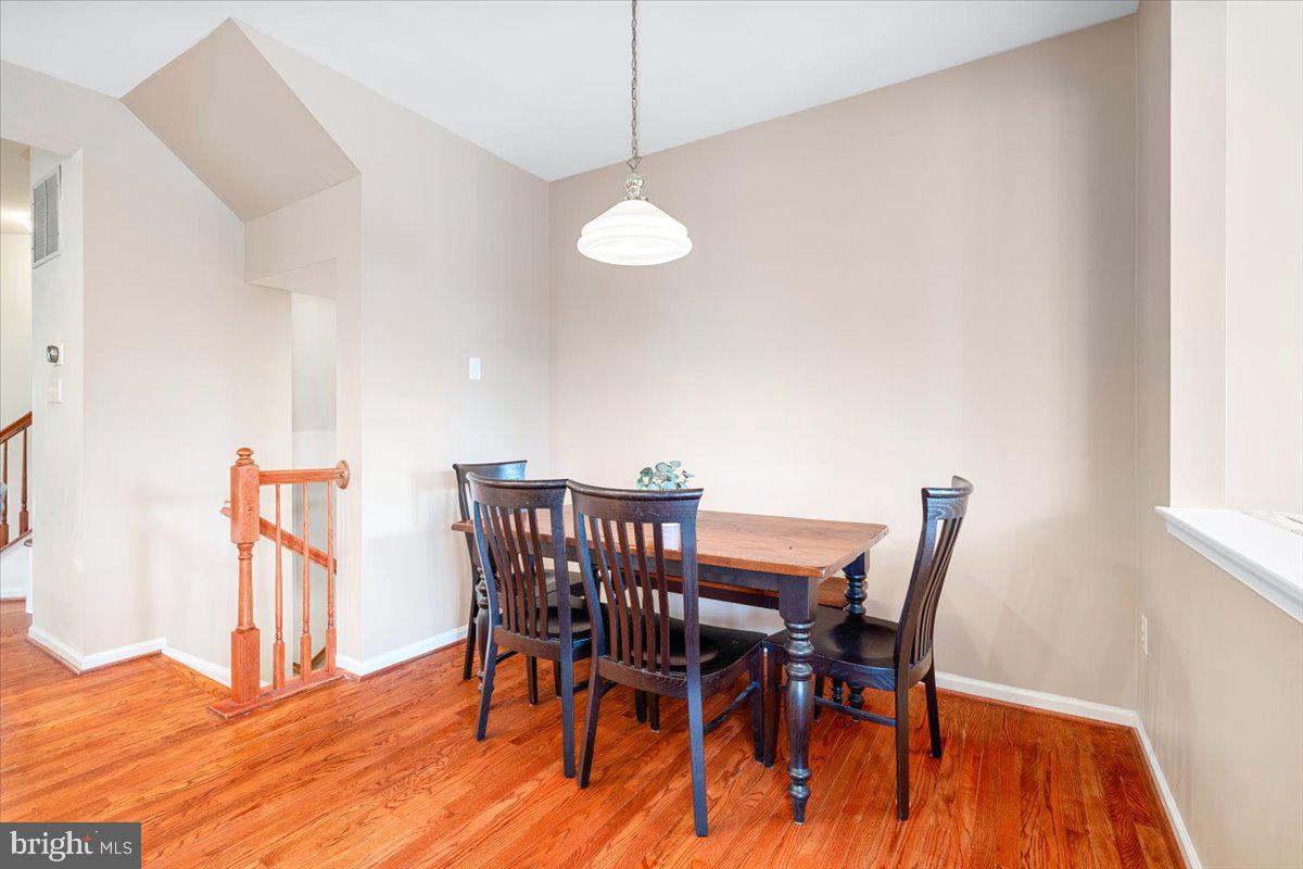 1729 Emory Street Frederick, MD 21701 - Photo 15 of 50 a view of a dining room with furniture and wooden floor