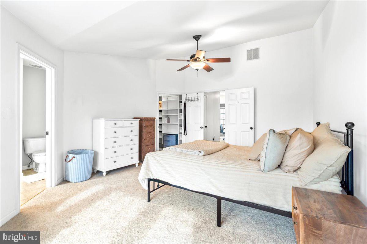 1729 Emory Street Frederick, MD 21701 - Photo 19 of 50 a bedroom with a bed and a chandelier