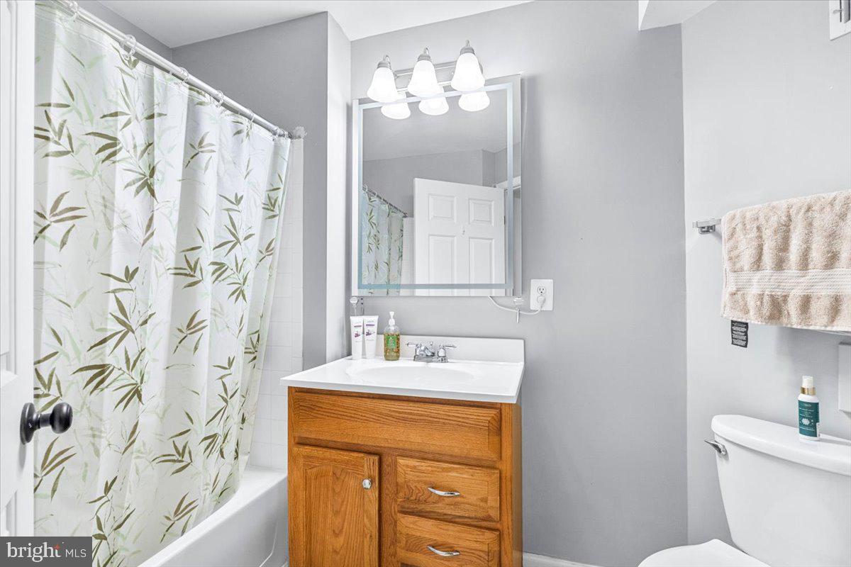 1729 Emory Street Frederick, MD 21701 - Photo 30 of 50 a bathroom with a sink and a mirror