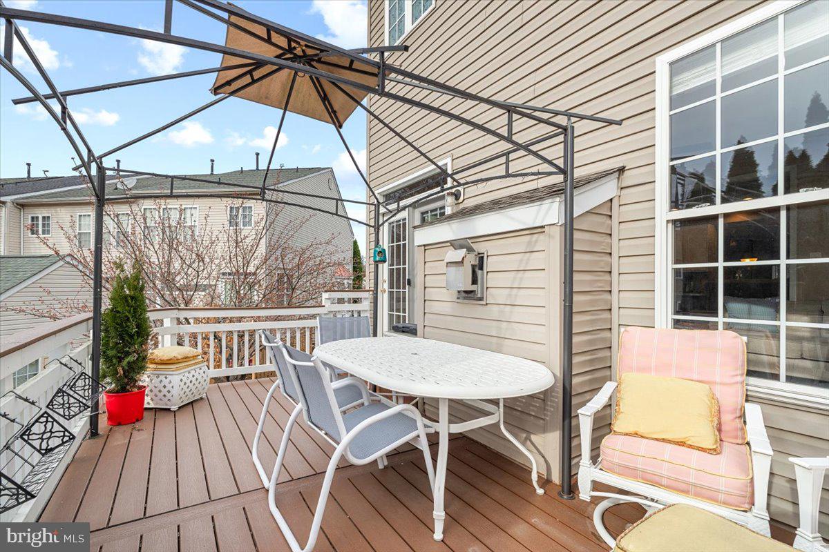1729 Emory Street Frederick, MD 21701 - Photo 34 of 50 a view of a patio with a table and chairs