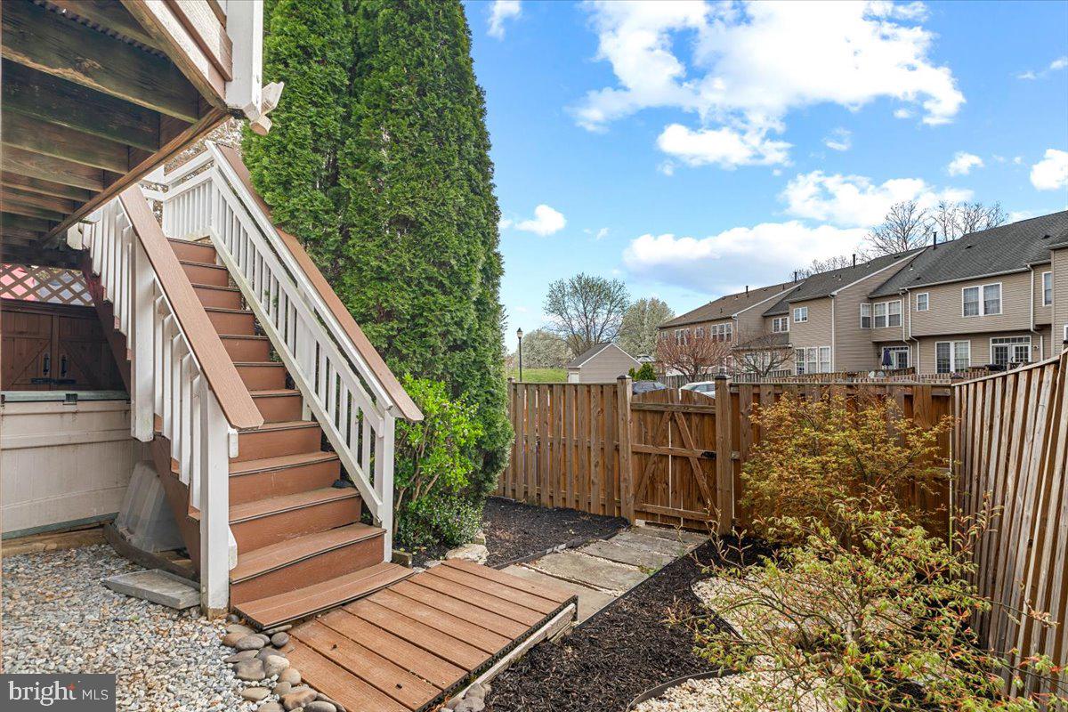 1729 Emory Street Frederick, MD 21701 - Photo 35 of 50 a view of a house with a small yard and wooden floor and fence